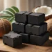Sustainable coconut shell charcoal briquettes stacked neatly on a wooden surface, surrounded by coconut shells and tropical leaves representing eco-friendly fuel production in Indonesia.